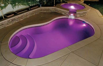 Round raised spa with one spillover cascade