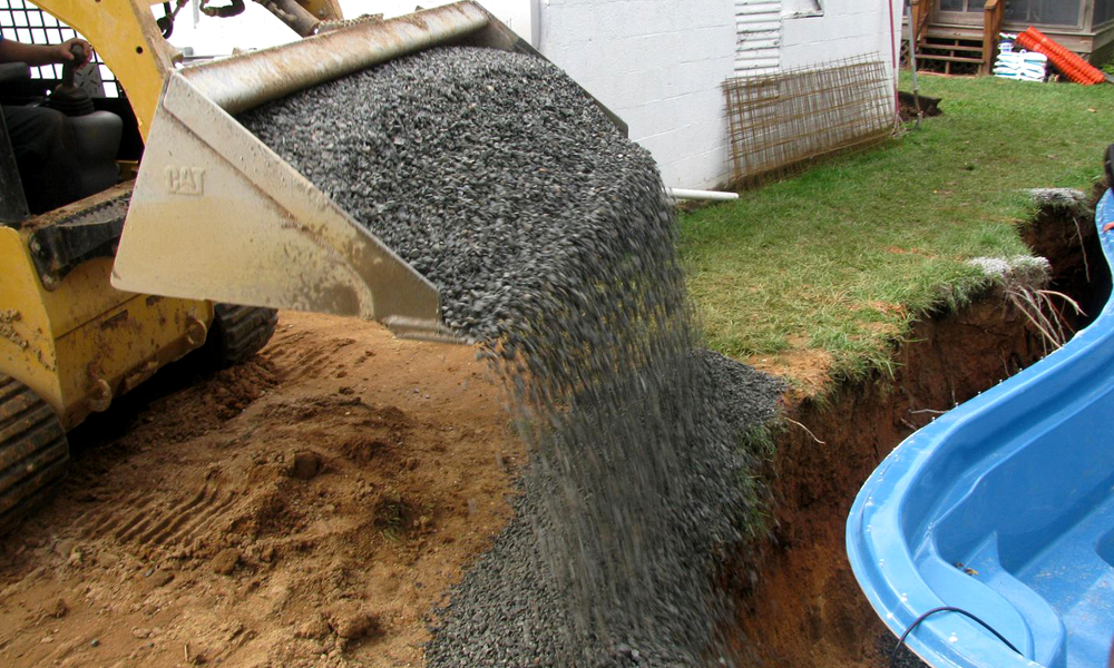 Backfilling fiberglass pool with stone